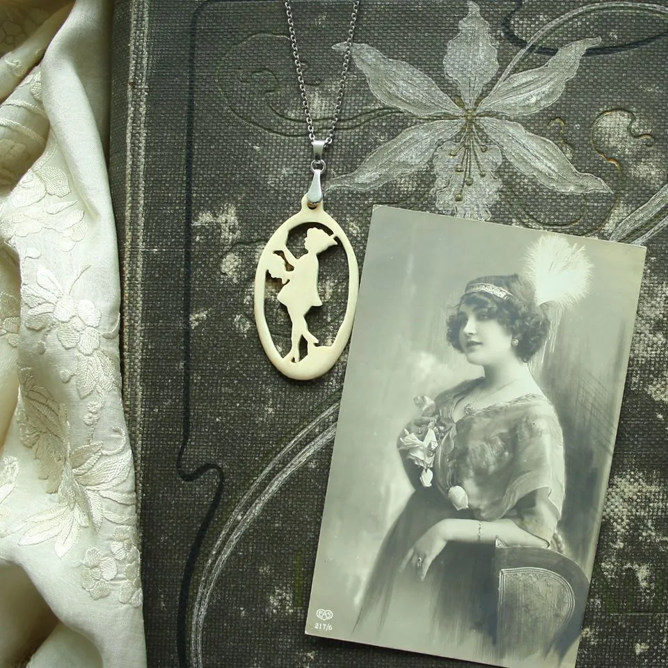 Lady with Flowers- antique carved bone fairy tale pendant. Handmade